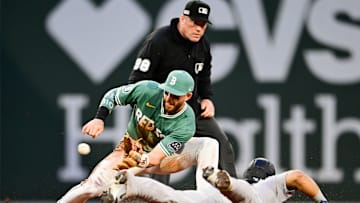 Trevor Story applies the tag to Jasson Domínguez in a New York Yankees v Boston Red Sox game.