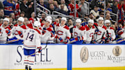 Mar 25, 2025; St. Louis, Missouri, USA;  Montreal Canadiens center Nick Suzuki (14) is congratulated by teammates after scoring against the St. Louis Blues during the first period at Enterprise Center. Mandatory Credit: Jeff Curry-Imagn Images