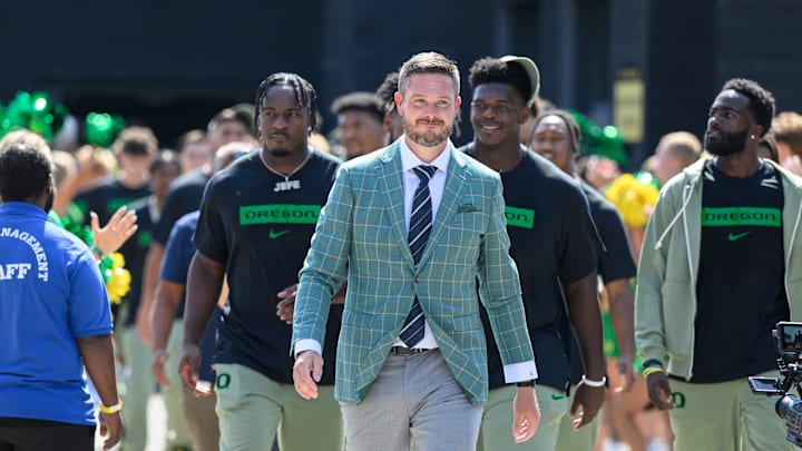 Aug 31, 2024; Eugene, Oregon, USA; Oregon Ducks head coach Dan Lanning leads the team into the stadium before the game against the Idaho Vandals at Autzen Stadium. Mandatory Credit: Craig Strobeck-Imagn Images