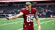 Nov 3, 2025; Arlington, Texas, USA; Arizona Cardinals tight end Trey McBride (85) celebrates after defeating the Dallas Cowboys at AT&T Stadium. 