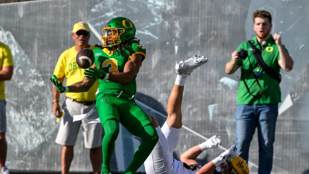 Aug 31, 2024; Eugene, Oregon, USA; Oregon Ducks defensive back Brandon Johnson (3) intercepts the ball in the end zone