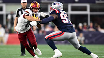 Aug 8, 2025; Foxborough, Massachusetts, USA; New England Patriots defensive end Milton Williams (97) tackles Washington Commanders wide receiver Luke McCaffrey (11) during the first half at Gillette Stadium. Mandatory Credit: Brian Fluharty-Imagn Images