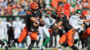 Oct 26, 2025; Cincinnati, Ohio, USA; Cincinnati Bengals quarterback Joe Flacco (16) passes the ball to running back Chase Brown (30) during the first quarter at Paycor Stadium. Mandatory Credit: Katie Stratman-Imagn Images