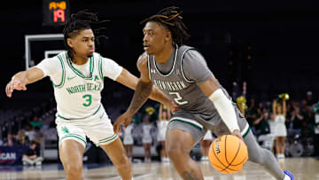 Mar 15, 2025; Fort Worth, TX, USA;  UAB Blazers guard Ja'Borri McGhee (2) drives to the basket as North Texas Mean Green guard Jasper Floyd (3) defends during the first half at Dickies Arena. Mandatory Credit: Chris Jones-Imagn Images