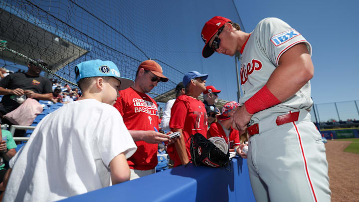 Mar 2, 2025; Dunedin, Florida, USA; Philadelphia Phillies infielder Aidan Miller (81) signs autographs for fans before a game against the Toronto Blue Jays during spring training at TD Ballpark. Mandatory Credit: Nathan Ray Seebeck-Imagn Images