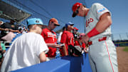 Mar 2, 2025; Dunedin, Florida, USA; Philadelphia Phillies infielder Aidan Miller (81) signs autographs for fans before a game against the Toronto Blue Jays during spring training at TD Ballpark. Mandatory Credit: Nathan Ray Seebeck-Imagn Images