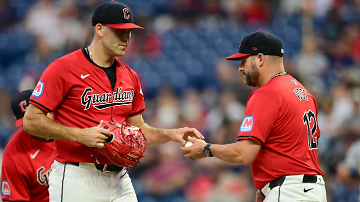 Sep 16, 2024; Cleveland, Ohio, USA; Cleveland Guardians manager Stephen Vogt (12) relieves starting pitcher Matthew Boyd (16) during the third inning against the Minnesota Twins at Progressive Field. Mandatory Credit: Ken Blaze-Imagn Images