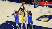 Indiana Pacers forward Pascal Siakam is defended by OKC Thunder's Luguentz Dort and Jalen Williams in the  2025 NBA Finals. 