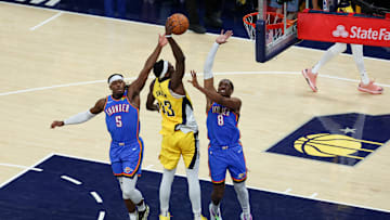 Indiana Pacers forward Pascal Siakam is defended by OKC Thunder's Luguentz Dort and Jalen Williams in the  2025 NBA Finals. 