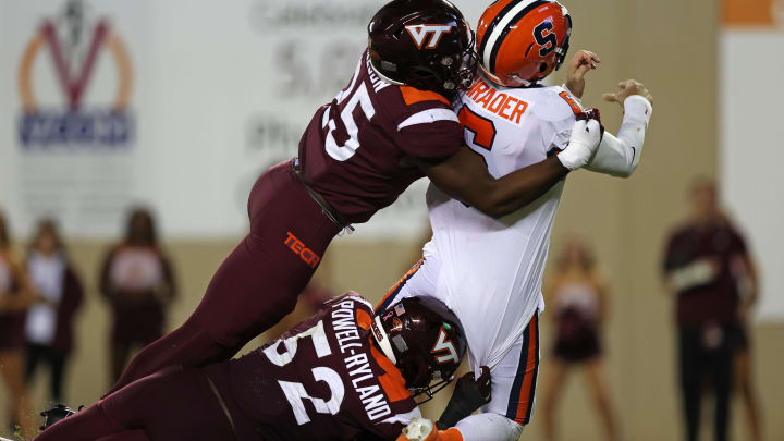 Oct 26, 2023; Blacksburg, Virginia, USA; Virginia Tech Hokies defensive linemanCole Nelson and defensive lineman Antwaun Powell-Ryland (52) sack Syracuse Orange quarterback Garrett Shrader (6) in the end zone for a safety during the third quarter at Lane Stadium. Mandatory Credit: Peter Casey-USA TODAY Sports