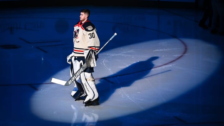 Milwaukee Admirals goaltender Yaroslav Askarov stands in the spotlight during pregame ceremonies before a game against the Texas Stars on Friday, January 19, 2024, at the UW-Milwaukee Panther Arena in Milwaukee, Wisconsin.