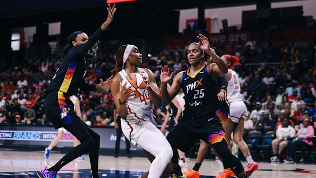 A photo of DeWanna Bonner and Alyssa Thomas playing defense