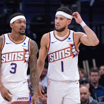 Apr 12, 2024; Sacramento, California, USA; Phoenix Suns guard Bradley Beal (3) and guard Devin Booker (1) walk off the court during a time out in the second quarter against the Sacramento Kings at Golden 1 Center. Mandatory Credit: Ed Szczepanski-Imagn Images