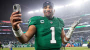 Nov 26, 2023; Philadelphia, Pennsylvania, USA; Philadelphia Eagles quarterback Jalen Hurts (1) reacts with a smart phone while walking off the field after an overtime victory against the Buffalo Bills at Lincoln Financial Field. Mandatory Credit: Bill Streicher-USA TODAY Sports