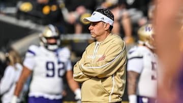 Oct 12, 2024; Iowa City, Iowa, USA; Washington Huskies head coach Jedd Fisch watches his team warm up before the game against the Iowa Hawkeyes at Kinnick Stadium. Mandatory Credit: Jeffrey Becker-Imagn Images