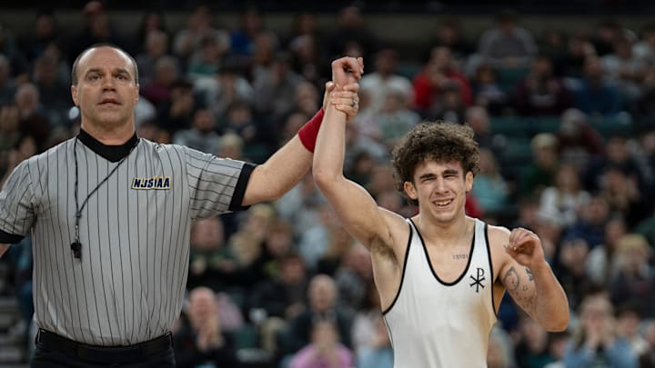 Saint John Vianney’s Anthony Knox’s hand is raised after defeating Bergen Catholic’s Nathan Braun in the championship XX match during finals of the NJSIAA individual wrestling state championships at Boardwalk Hall in Atlantic City on Friday, March 8, 2025. Saint John Vianney’s Anthony Knox is awarded the 126-pound state championship title and is a 4-time state champion. Saint John Vianney’s Anthony Knox’s hand is raised after defeating Bergen Catholic’s Nathan Braun in the championship XX match during finals of the NJSIAA individual wrestling state championships at Boardwalk Hall in Atlantic City on Friday, March 8, 2025. Saint John Vianney’s Anthony Knox is awarded the 126-pound state championship title and is a 4-time state champion.
