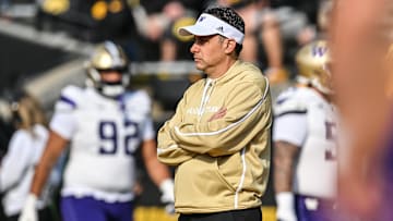 Oct 12, 2024; Iowa City, Iowa, USA; Washington Huskies head coach Jedd Fisch watches his team warm up before the game against the Iowa Hawkeyes at Kinnick Stadium. Mandatory Credit: Jeffrey Becker-Imagn Images