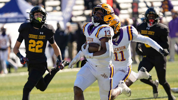 Dec 6, 2024; Birmingham, AL, USA; Jackson's Ezavier Crowell (13) breaks a long touchdown run on the Aggie’s first possession against Cherokee County at Protective Stadium in the AHSAA 4A State Championship game.
