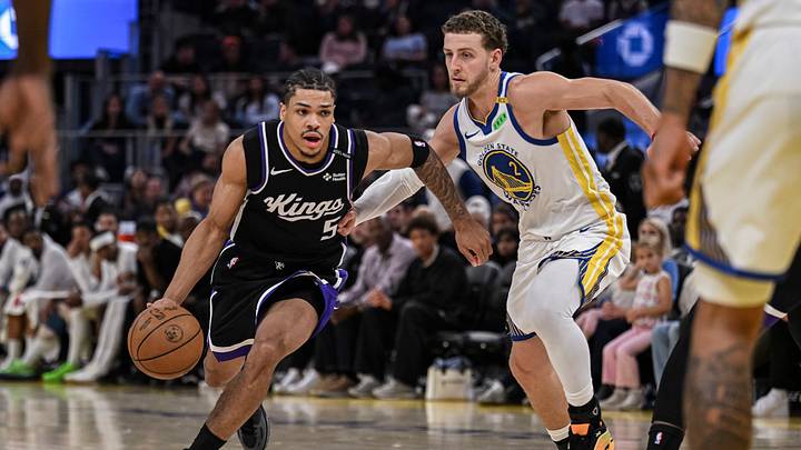 Oct 10, 2026; San Francisco, California, USA;  Sacramento Kings guard Darius Acuff Jr. (5) dribbles against Golden State Warriors guard Brandin Podziemski (2) during the second quarter at Chase Center.  Mandatory Credit: Justine Willard-Imagn Images