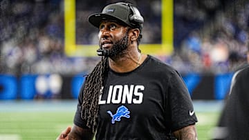 Detroit Lions defensive coordinator Kelvin Sheppard watches a replay against Tampa Bay Buccaneers during the second half at Ford Field in Detroit on Monday, Oct. 20, 2025.