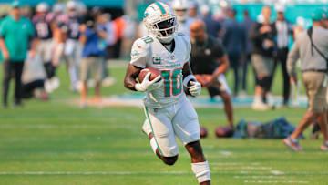 Nov 24, 2024; Miami Gardens, Florida, USA; Miami Dolphins wide receiver Tyreek Hill (10) runs with the football before the game against the New England Patriots at Hard Rock Stadium. Mandatory Credit: Sam Navarro-Imagn Images