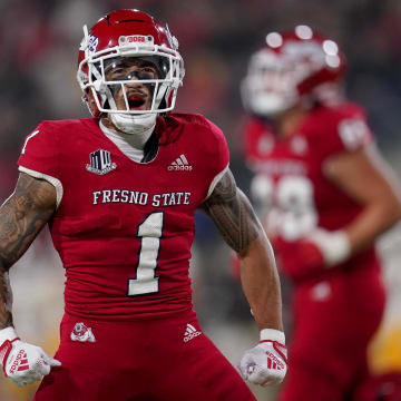 Nov 25, 2022; Fresno, California, USA; Fresno State Bulldogs wide receiver Nikko Remigio (1) reacts after catching a pass for a touchdown against the Wyoming Cowboys in the first quarter at Valley Children's Stadium. Mandatory Credit: Cary Edmondson-USA TODAY Sports