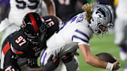 Kansas State's quarterback Avery Johnson scores a touchdown against Texas Tech in a Big 12 conference football game.