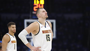 May 18, 2025; Oklahoma City, Oklahoma, USA; Denver Nuggets center Nikola Jokic (15) watches Oklahoma City Thunder guard Shai Gilgeous-Alexander shoot free throws in the second half of game seven of the second round for the 2025 NBA Playoffs at Paycom Center. Mandatory Credit: Alonzo Adams-Imagn Images