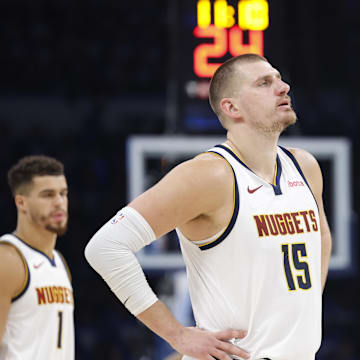 May 18, 2025; Oklahoma City, Oklahoma, USA; Denver Nuggets center Nikola Jokic (15) watches Oklahoma City Thunder guard Shai Gilgeous-Alexander shoot free throws in the second half of game seven of the second round for the 2025 NBA Playoffs at Paycom Center. Mandatory Credit: Alonzo Adams-Imagn Images