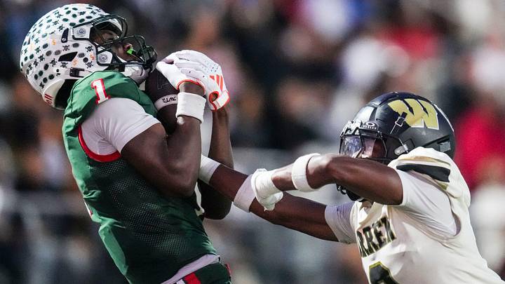 Lawrence North Wildcats Monshun Sales (1) catches a pass against Warren Central Terrell Harris (2) on Friday, Oct. 3, 2025, during a game between the Lawrence North Wildcats and Warren Central at Lawrence North High School in Indianapolis.