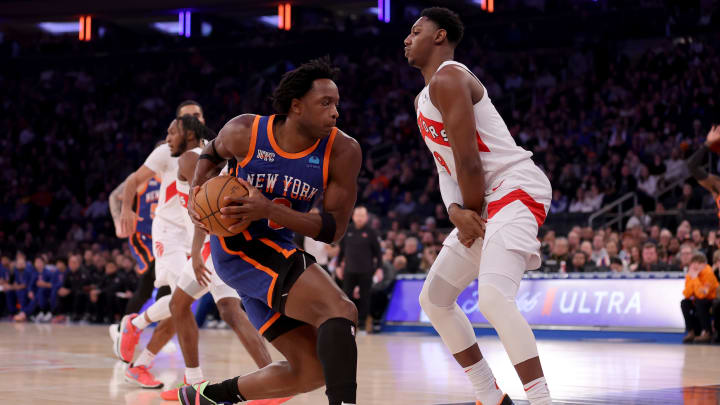 Jan 20, 2024; New York, New York, USA; New York Knicks forward OG Anunoby (8) drives to the basket against Toronto Raptors guard RJ Barrett (9) during the first quarter at Madison Square Garden. Mandatory Credit: Brad Penner-USA TODAY Sports