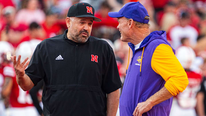 Sep 14, 2024; Lincoln, Nebraska, USA; Nebraska Cornhuskers head coach Matt Rhule and Northern Iowa Panthers head coach Mark Farley talk before the game at Memorial Stadium.