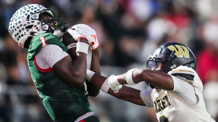 Lawrence North Wildcats Monshun Sales (1) catches a pass against Warren Central Terrell Harris (2) on Friday, Oct. 3, 2025, during a game between the Lawrence North Wildcats and Warren Central at Lawrence North High School in Indianapolis.