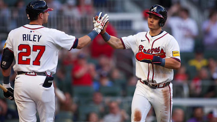 Atlanta Braves right fielder Stuart Fairchild (17) celebrates with third baseman Austin Riley (27) after scoring a run against the Washington Nationals in the third inning at Truist Park.
