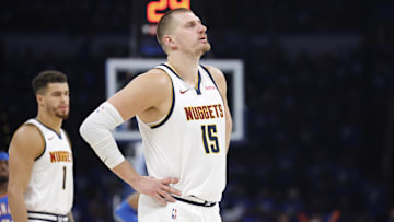 May 18, 2025; Oklahoma City, Oklahoma, USA; Denver Nuggets center Nikola Jokic (15) watches Oklahoma City Thunder guard Shai Gilgeous-Alexander shoot free throws in the second half of game seven of the second round for the 2025 NBA Playoffs at Paycom Center. Mandatory Credit: Alonzo Adams-Imagn Images