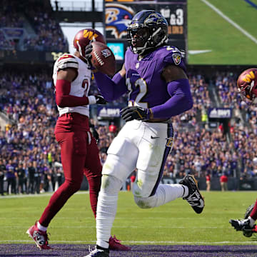 Baltimore Ravens running back Derrick Henry rushes for a second quarter touchdown against the Washington Commanders.