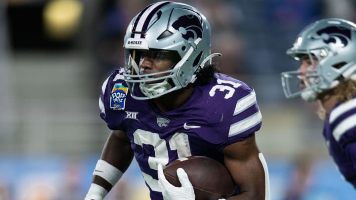 Dec 28, 2023; Orlando, FL, USA; Kansas State running back DJ Giddens runs the ball against NC State in the first quarter at Camping World Stadium. Mandatory Credit: Jeremy Reper-USA TODAY Sports