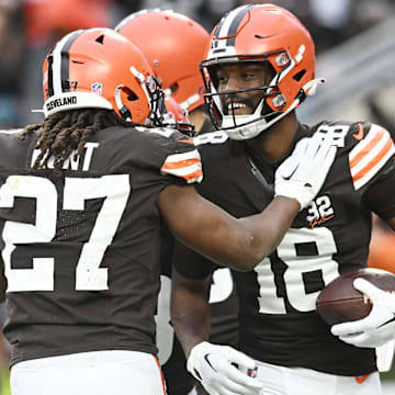 Dec 10, 2023; Cleveland, Ohio, USA; Cleveland Browns running back Kareem Hunt (27) and wide receiver David Bell (18) celebrate after Bell caught a touchdown pass during the second half against the Jacksonville Jaguars at Cleveland Browns Stadium.