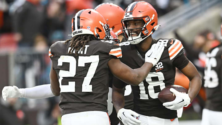 Dec 10, 2023; Cleveland, Ohio, USA; Cleveland Browns running back Kareem Hunt (27) and wide receiver David Bell (18) celebrate after Bell caught a touchdown pass during the second half against the Jacksonville Jaguars at Cleveland Browns Stadium.