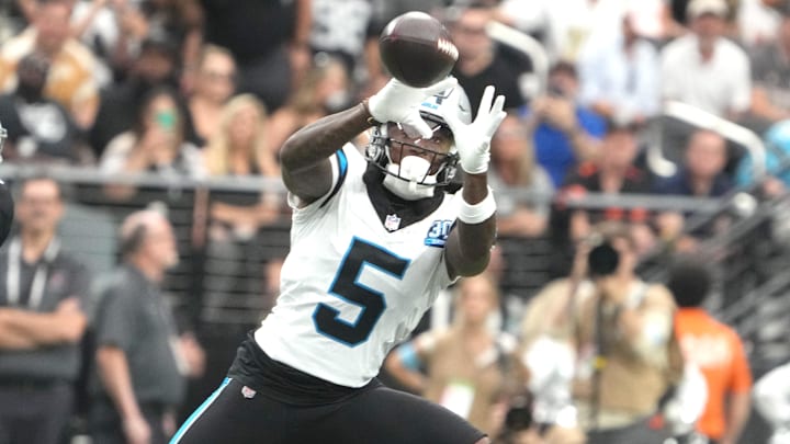 Sep 22, 2024; Paradise, Nevada, USA; Carolina Panthers wide receiver Diontae Johnson (5) catches the ball against Las Vegas Raiders cornerback Jakorian Bennett (0) in the first half at Allegiant Stadium. Mandatory Credit: Kirby Lee-Imagn Images