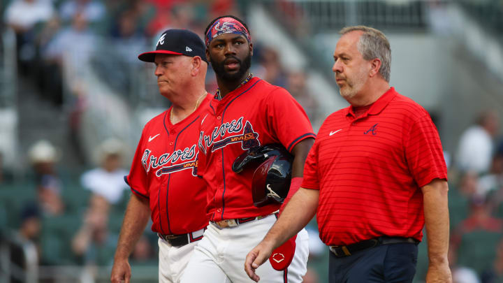 Atlanta Braves manager Brian Snitker and center fielder Michael Harris II walks off the field after an injury 