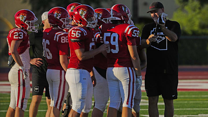 Brophy Prep head coach Jason Jewell instructs his team during a practice at Brophy College Prepatory in Phoenix on Sept. 4, 2024.