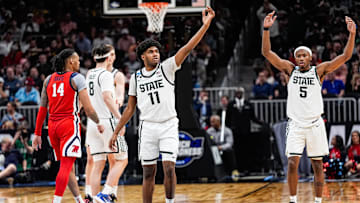 Michigan State guards Jase Richardson (11) and Tre Holloman (5) celebrate against Ole Miss during the second half of the Sweet 16 round of the NCAA tournament at State Farm Arena in Atlanta on Friday, March 28, 2025.