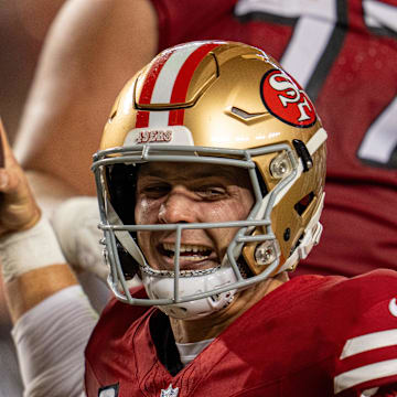 Oct 27, 2024; Santa Clara, California, USA; San Francisco 49ers quarterback Brock Purdy (13) spikes the football after scoring the touchdown against the Dallas Cowboys during the third quarter at Levi's Stadium. Mandatory Credit: Neville E. Guard-Imagn Images