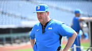 Jun 14, 2025; Omaha, Neb, USA;  UCLA Bruins head coach John Savage on the field before the game against the Murray State Races at Charles Schwab Field. Mandatory Credit: Steven Branscombe-Imagn Images