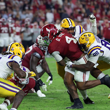 Nov 8, 2025; Tuscaloosa, Alabama, USA; Louisiana State Tigers defensive lineman Bernard Gooden (88) tackles Alabama Crimson Tide running back Daniel Hill (4) during the fourth quarter of the game at Saban Field at Bryant-Denny Stadium. Mandatory Credit: David Leong-Imagn Images