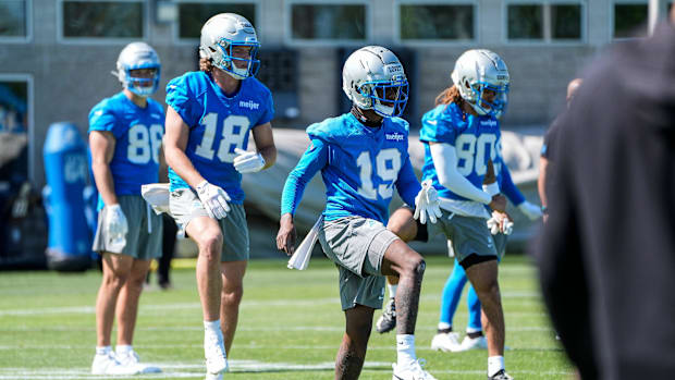 Detroit Lions wide receivers Dominic Lovett (19) and Isaac TeSlaa (18) practice during rookie minicamp in Allen Park
