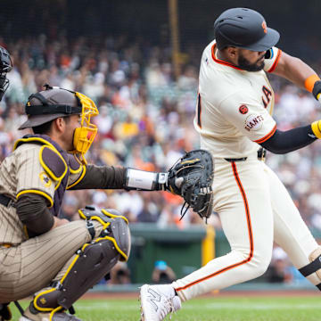 Sep 15, 2024; San Francisco, California, USA; San Francisco Giants outfielder Heliot Ramos (21) hits a solo home run during the ninth inning against the San Diego Padres at Oracle Park.