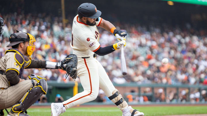 Sep 15, 2024; San Francisco, California, USA; San Francisco Giants outfielder Heliot Ramos (21) hits a solo home run during the ninth inning against the San Diego Padres at Oracle Park.