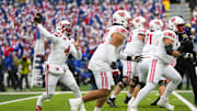 Utah Utes quarterback Devon Dampier (4) throws a pass during the first half against the Kansas Jayhawks at David Booth Kansas Memorial Stadium.